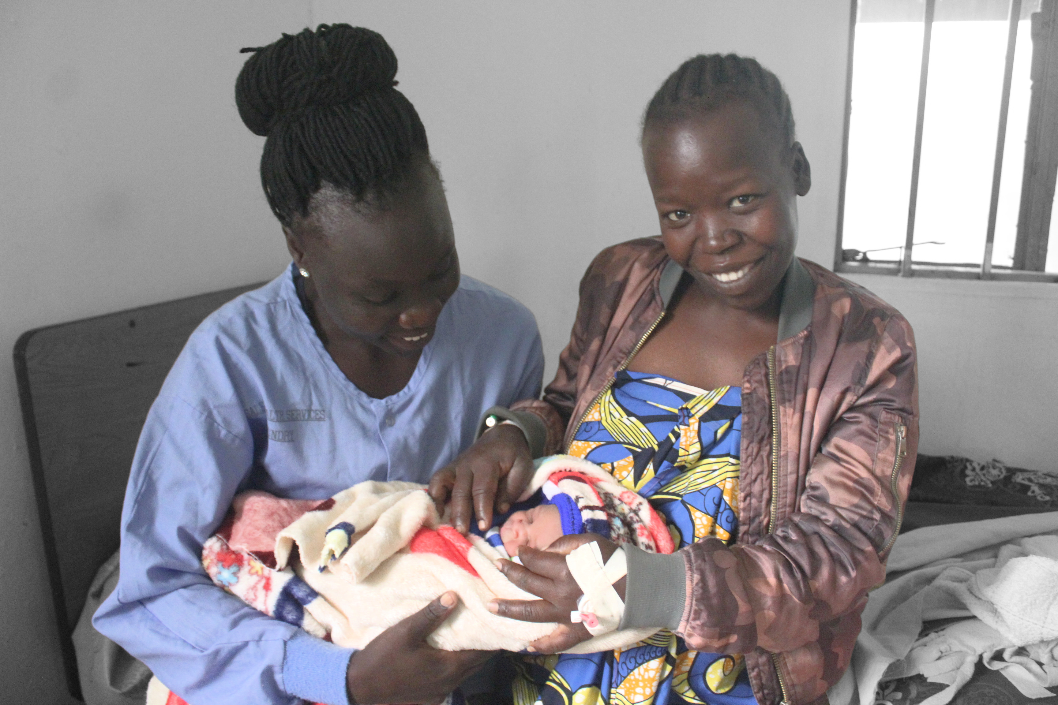 Jackline-Midwife (left), Mother to newborn baby Jesca at HHHF_SM.jpg